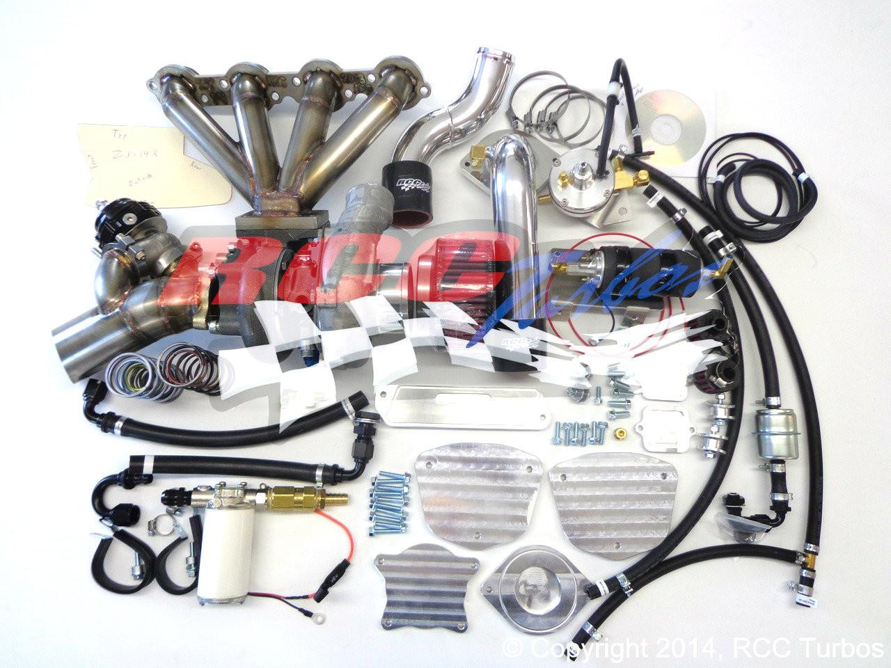 RCC Turbo Kit Stage 1 Kawasaki ZX14R (12-25), automotive turbocharger upgrade parts including exhaust manifold, intercooler piping, hoses, and electronic components displayed on a white background.