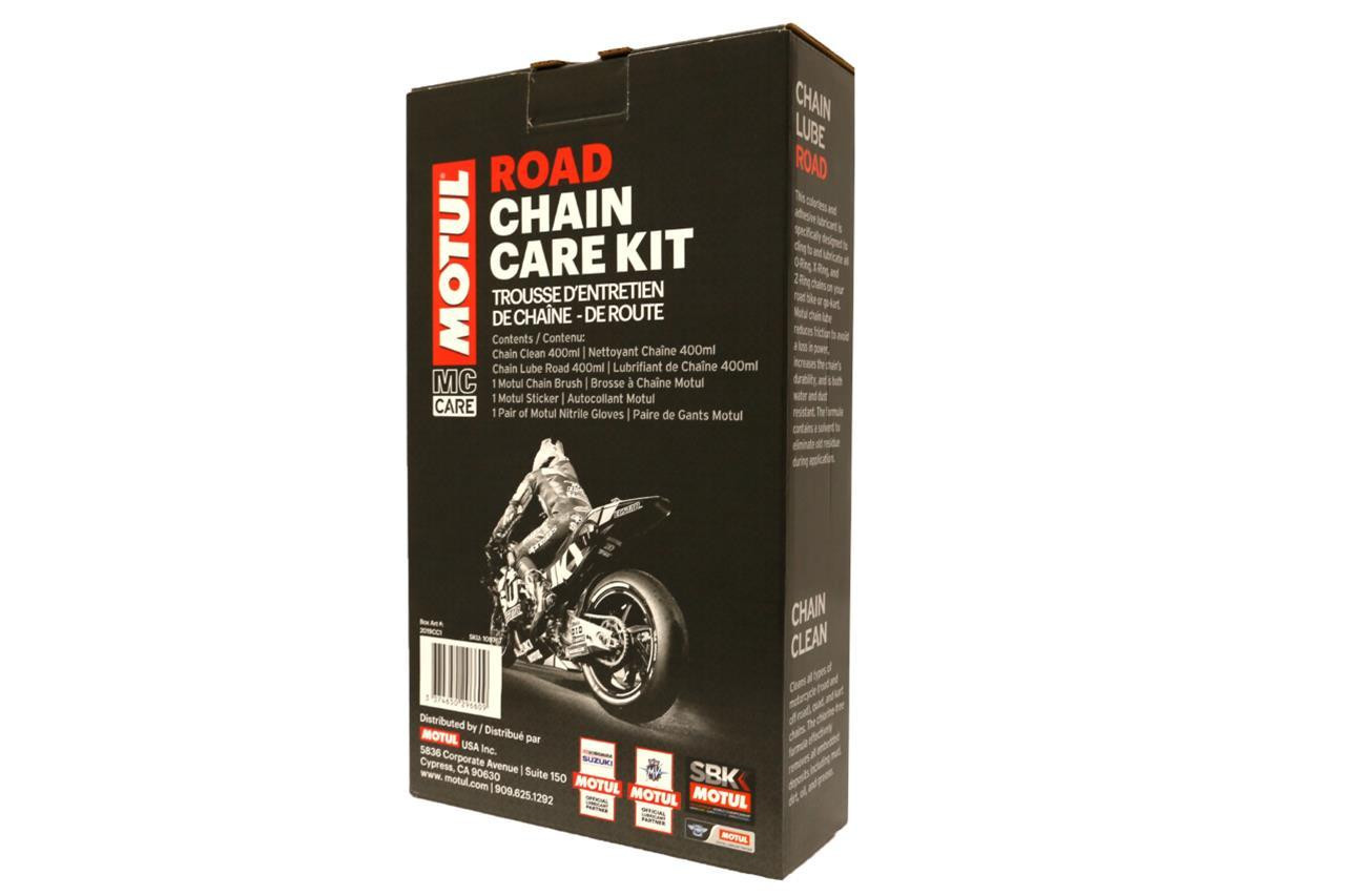 Motul Road Chain Care Kit, black packaging box with motorcycle image, containing chain cleaner, lubricant, brush, sticker, gloves, and instructions for motorcycle chain maintenance. Motul Road Chain Care Kit, black packaging box with motorcycle image, containing chain cleaner, lubricant, brush, sticker, gloves, and instructions for motorcycle chain maintenance.