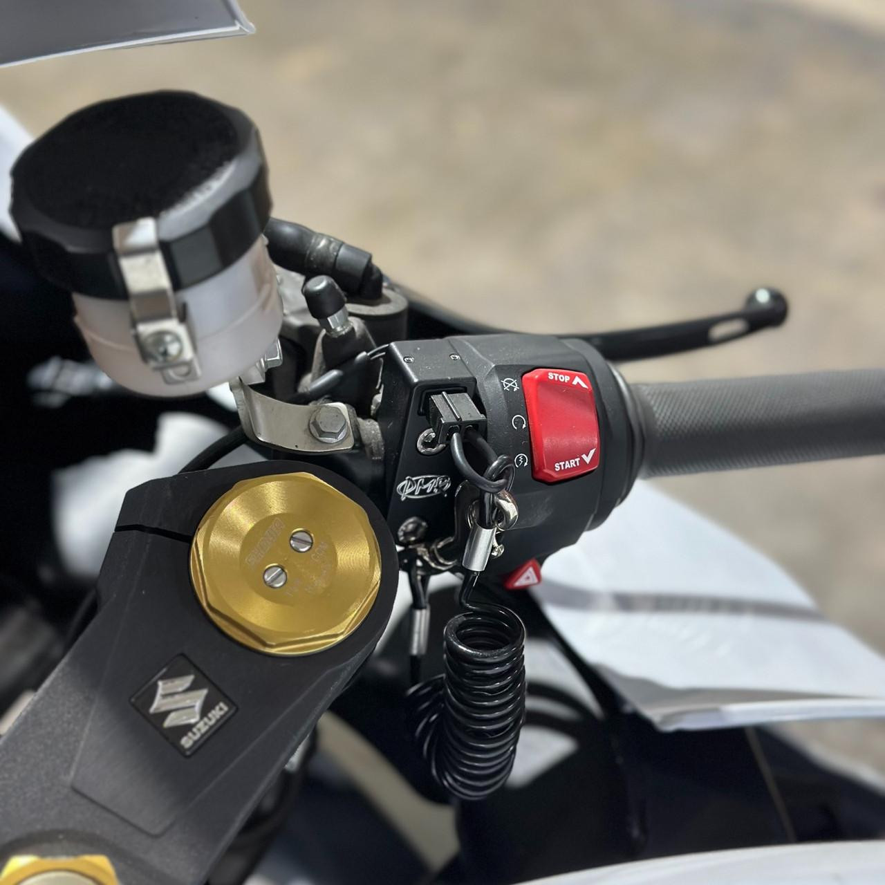 PMR Components PMR Easy Mount Stealth Tether Kill Switch, motorcycle handlebar with emergency stop and start buttons, key lock with tether safety feature, and electronic control