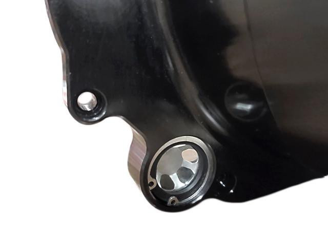 VooDoo Quick Access Clutch Cover Kawasaki ZX-14R (06-25), close-up view of the clutch cover showing its black finish and metallic bolt hole for easy installation.