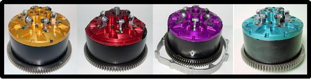 MTC Multistage Lock Up Gen II Suzuki GSXR1000 (01-08), four high-performance lock-up clutch components in gold, red, purple, and blue with intricate metallic design and gear teeth at the base.
