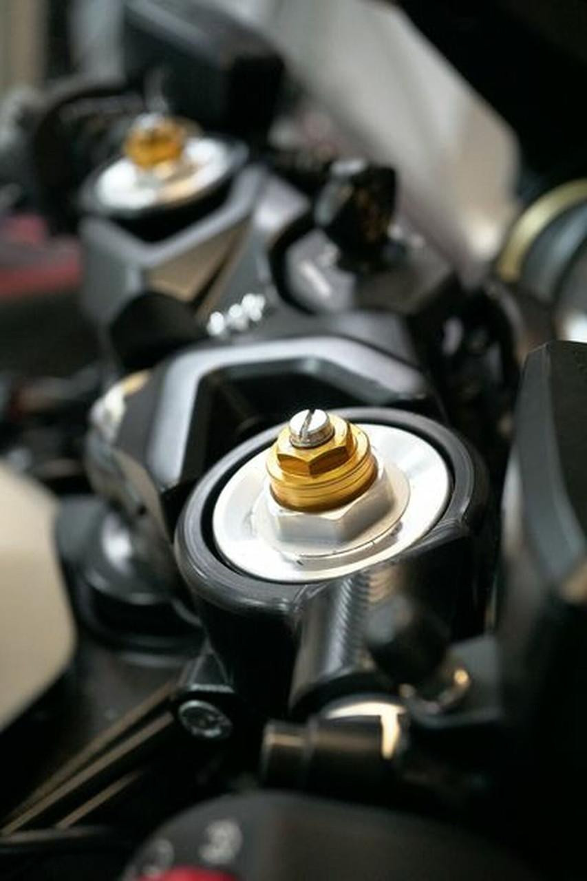 HTP Performance Handlebar Mounts Suzuki Hayabusa (22-26), close-up view of handlebar mounts with gold and black components installed on the motorcycle's handlebars.