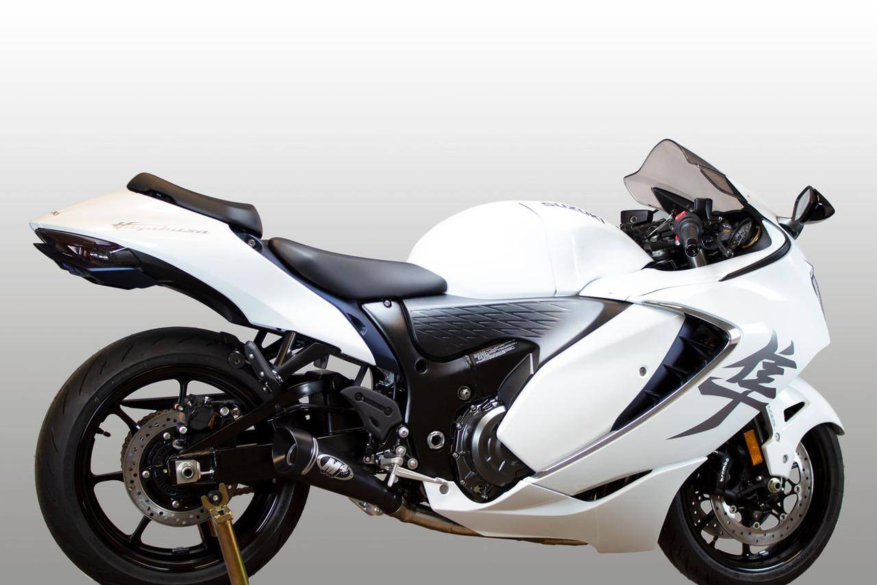 M4 Performance Exhausts M4 GP Black Exhaust Suzuki GSX1300R Hayabusa (08-25), motorcycle with a sleek white design and black exhaust system.