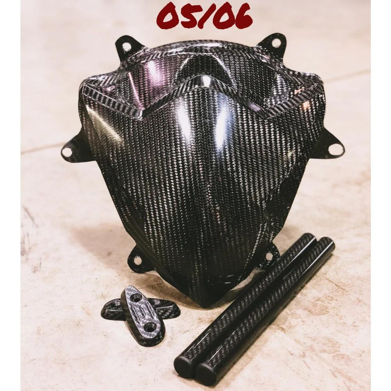 Montgomery Motorsports GSXR1000 (05-06) Starter Kit, carbon fiber engine cover, including two carbon fiber pipes and mounting hardware.