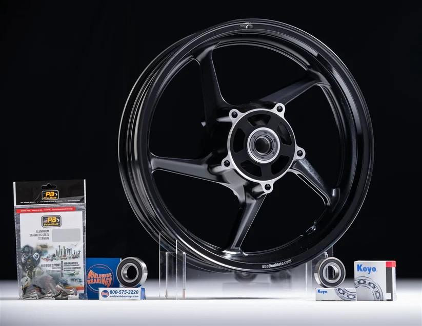 VooDoo Sniper Front Wheel Suzuki Hayabusa (22-26), black motorcycle wheel with spokes and hub, motorcycle wheel accessories and packaging displayed on a black background.