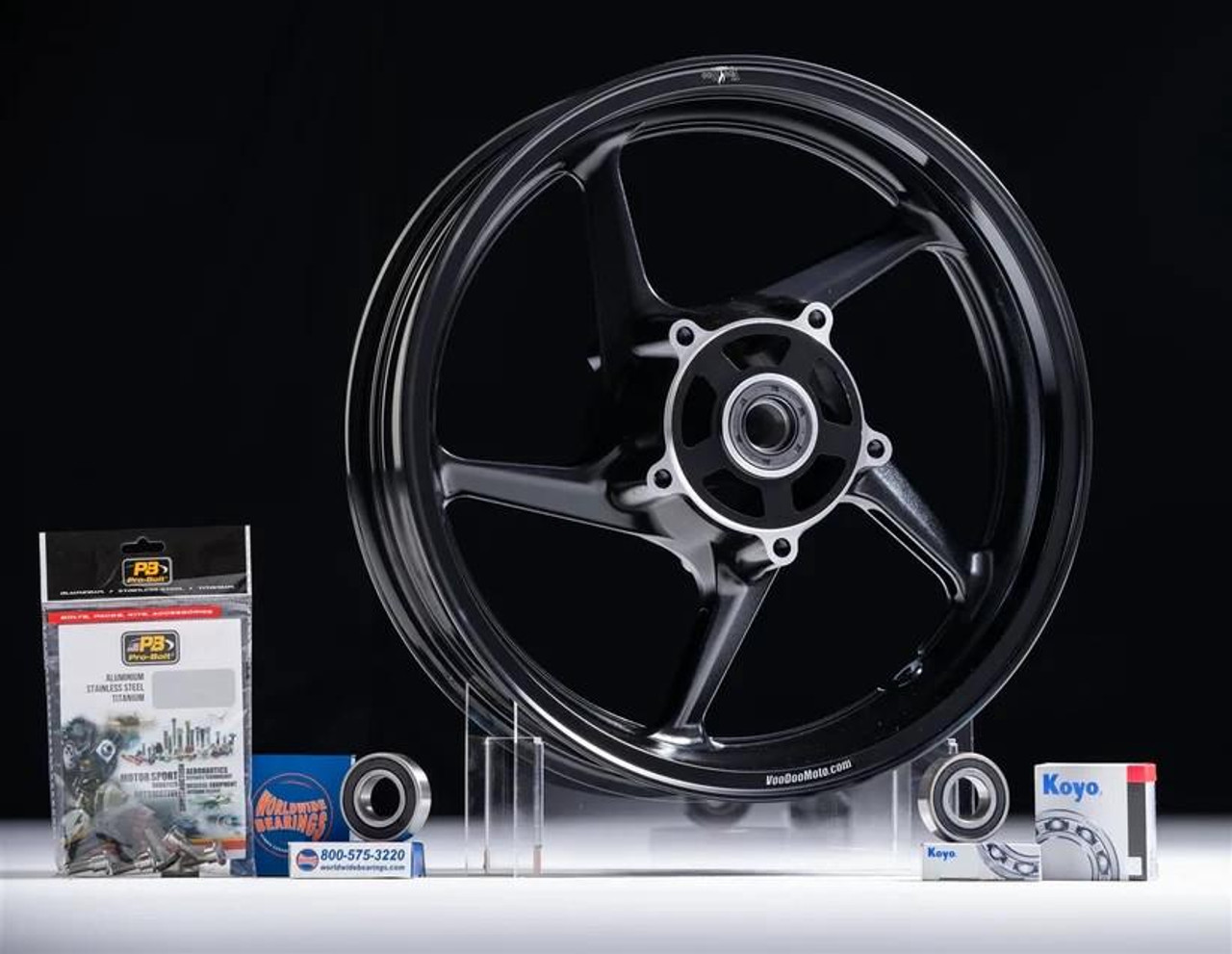 VooDoo Sniper Front Wheel Suzuki GSXR1000 (05-25), black alloy motorcycle wheel with bearings, brake discs, and installation accessories displayed for motorcycle upgrade.