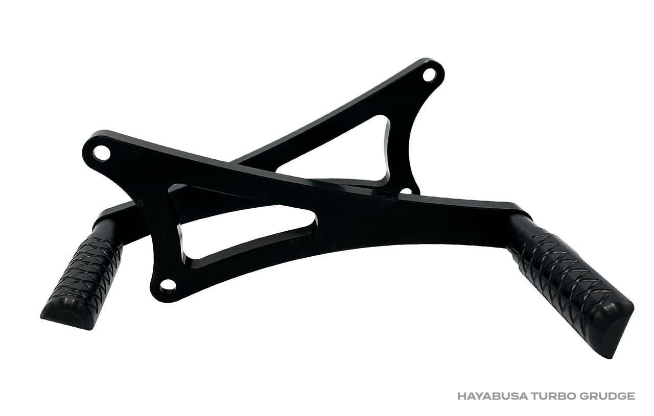 DME Rear Sets, Grudge, Turbo, Suzuki Hayabusa (99-25), black motorcycle rearset footpeg and gear shifter for improved performance and style.