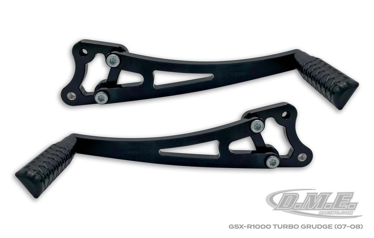 DME Rearsets, Grudge, Turbo, Suzuki GSXR1000 (05-08), black motorcycle rearset footpegs with mounting hardware.