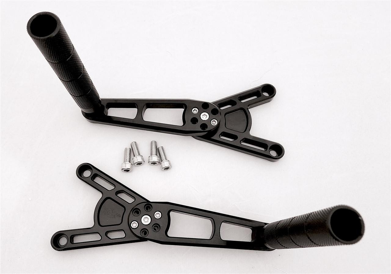 VooDoo Voodoo Rearsets, Grudge, Suzuki Hayabusa (99-25) - black racing motorcycle rearsets with footpegs, mounting plates, and screws.