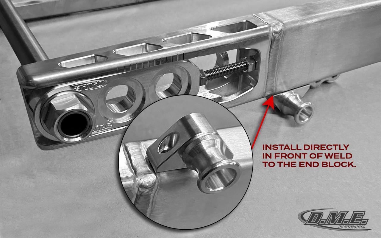 DME Swingarm Spool Bolt-on Mounts, close-up of adjustable mount with mounting hole for motorcycle swingarm. DME Swingarm Spool Bolt-on Mounts, close-up of adjustable mount with mounting hole for motorcycle swingarm.