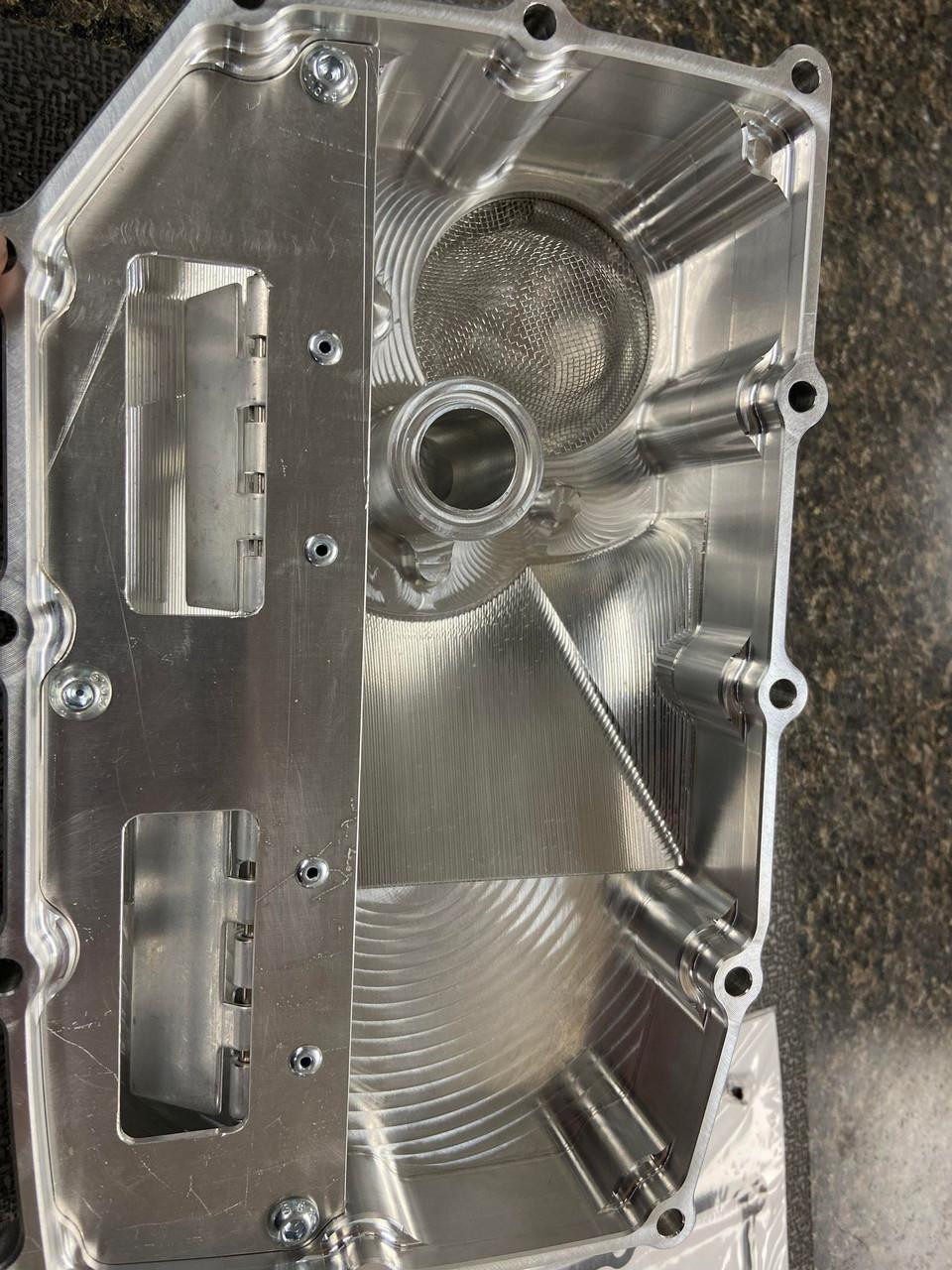 Brutal Performance Low Profile Billet Oil Pan Suzuki GSXR1000 (17-25) Direct Pickup, shiny metallic engine oil pan with precision-machined surfaces and mounting holes.