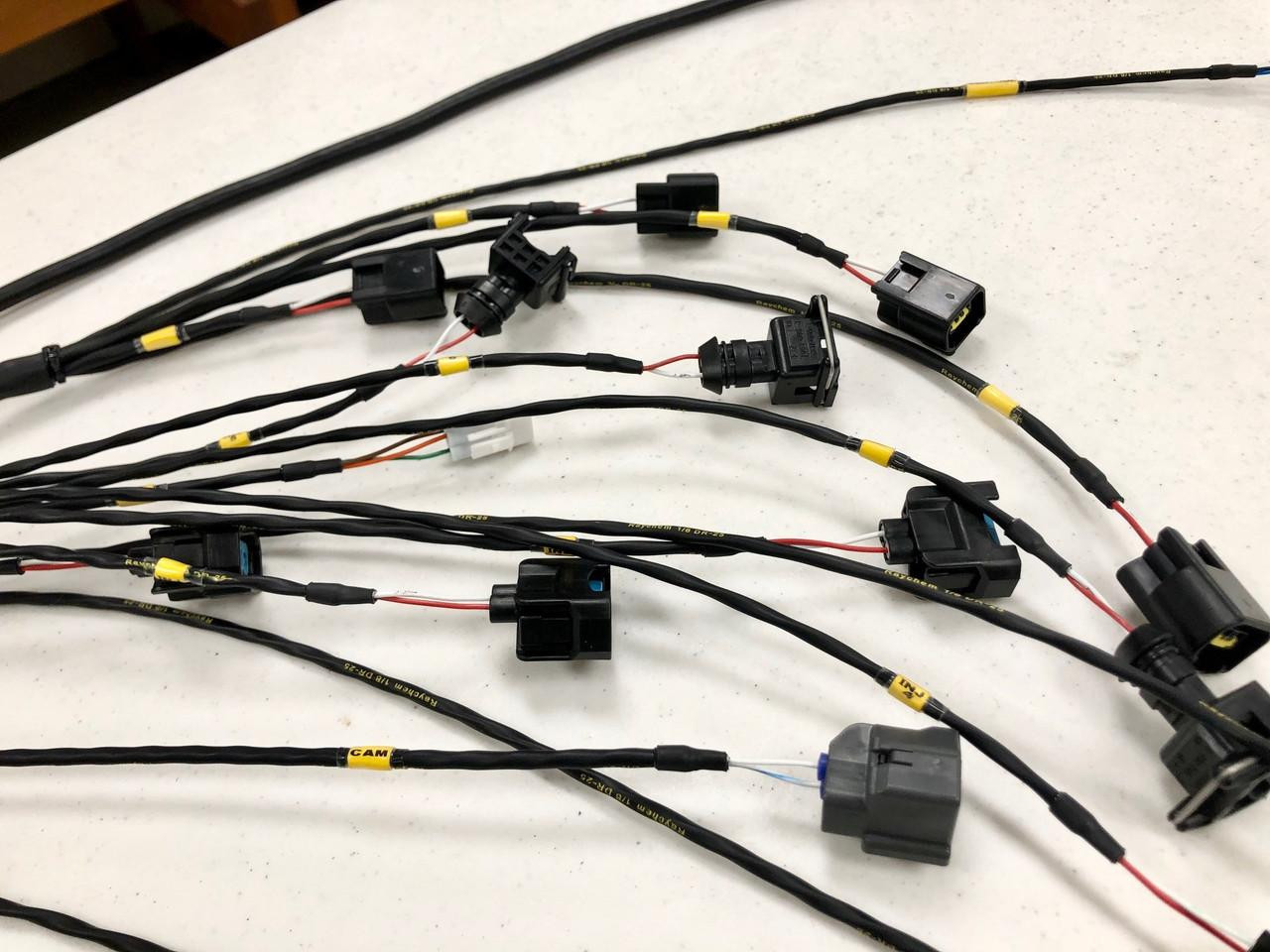 Ryan Schnitz Racing Custom Wiring Harness Deposit - Fueltech, black electrical wiring harness with multiple connectors and labels for automotive use. Ryan Schnitz Racing Custom Wiring Harness Deposit - Fueltech, black electrical wiring harness with multiple connectors and labels for automotive use.