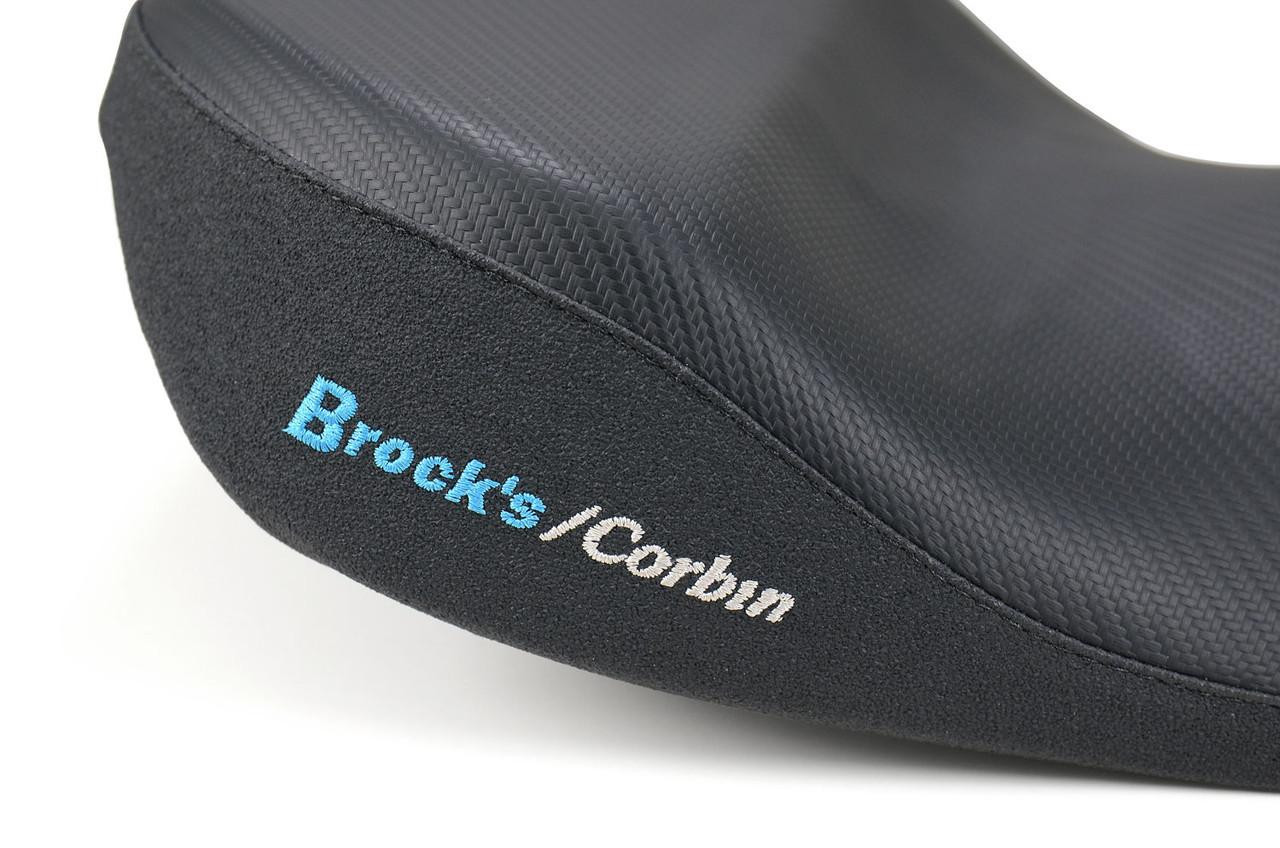 Brocks Performance Custom Corbin Seat for BMW S1000RR (20-25) and S1000R (20-24), close-up of the black textured motorcycle seat with embroidered Brocks/Corbin logo.