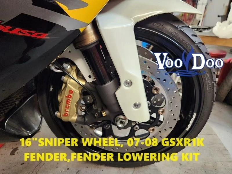 VooDoo Voodoo Front Fender Lowering Bracket for Suzuki Hayabusa 99-21 and GSXR1000 01-08, installed on a motorcycle front wheel with brake disc and Brembo caliper.