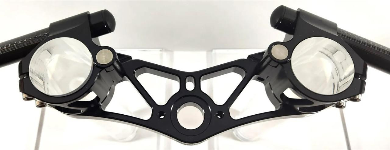 VooDoo Voodoo Top Triple Clamp Complete Kit Suzuki Hayabusa (99-25), image of a black motorcycle triple clamp with mounting holes and handlebar attachment points.