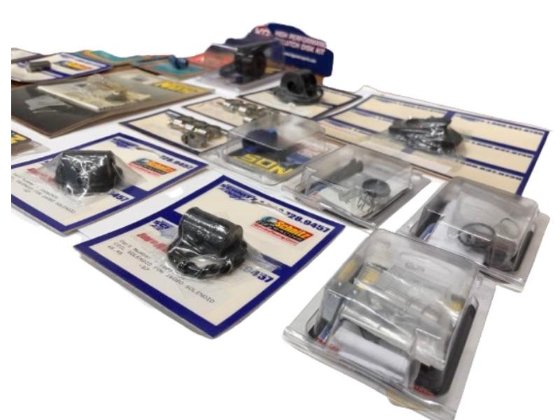 Schnitz Racing Miscellaneous NOS Supplies, assortment of automotive NOS parts and accessories in packaging and on display