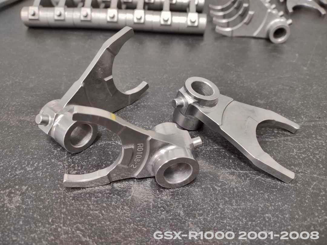 Monster Race Billet Shift Forks For Motorcycle, high-quality billet shift forks for Suzuki GSXR1000 (01-25) with a sleek metallic finish and precise machining.