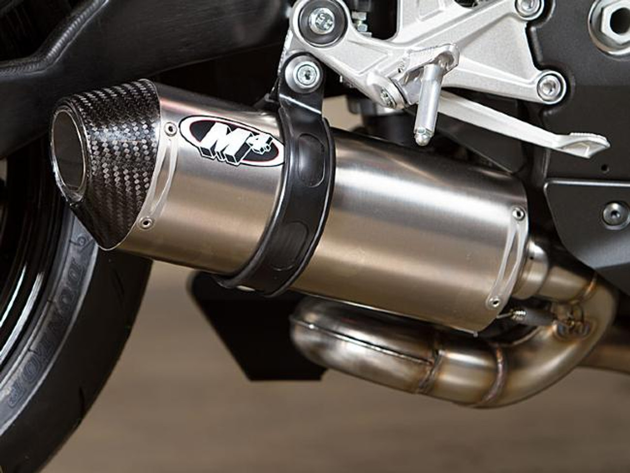 M4 Performance Exhausts M4 Street Slayer Titanium Slip On Exhaust for Honda CBR1000RR (08-16), close-up of the stainless steel and carbon fiber exhaust pipe installed on the motorcycle.