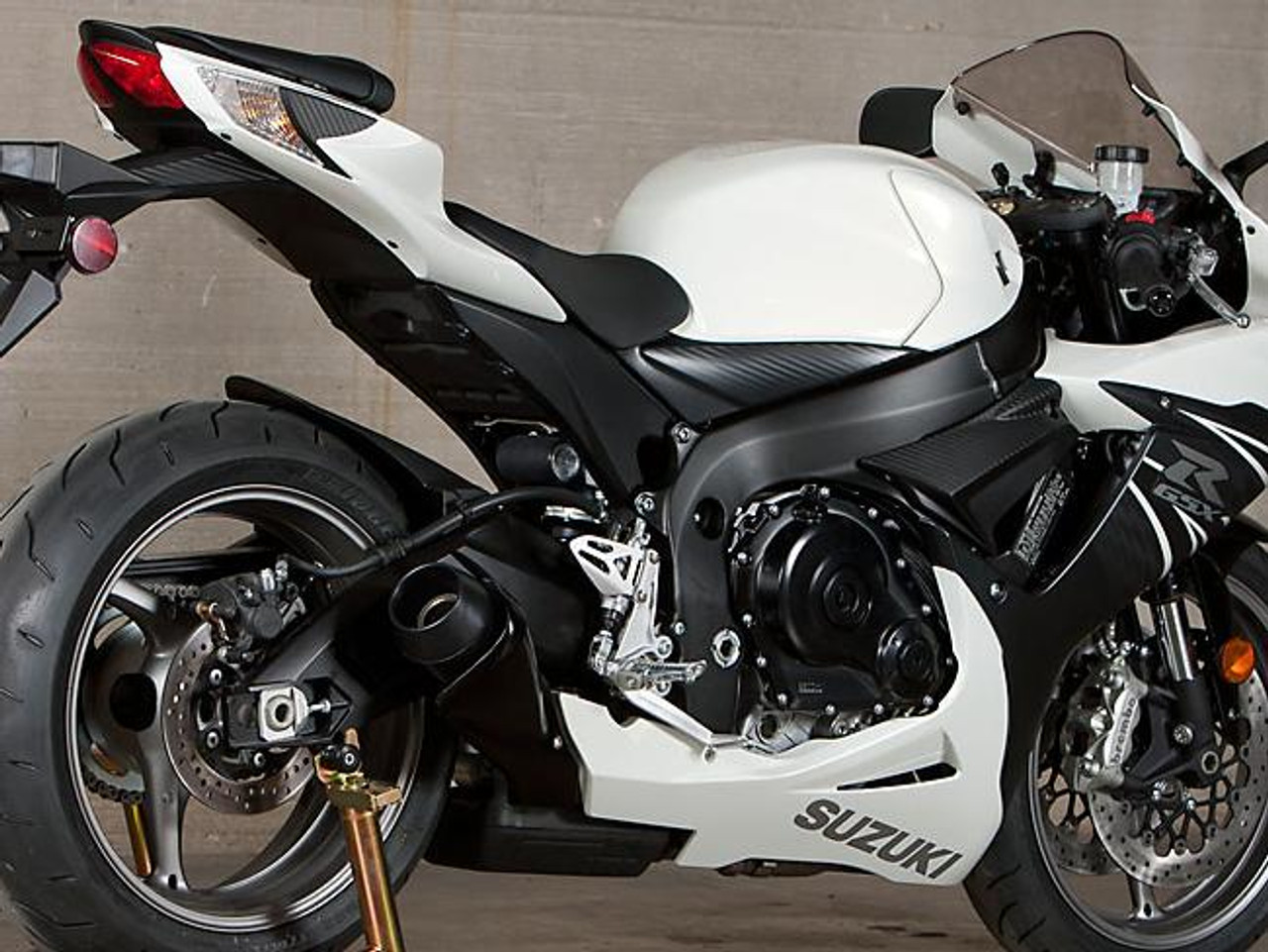 M4 Performance Exhausts M4 GP Black Slip On Exhaust Suzuki GSXR600/750 (11-24), black and silver motorcycle with slip-on exhaust system