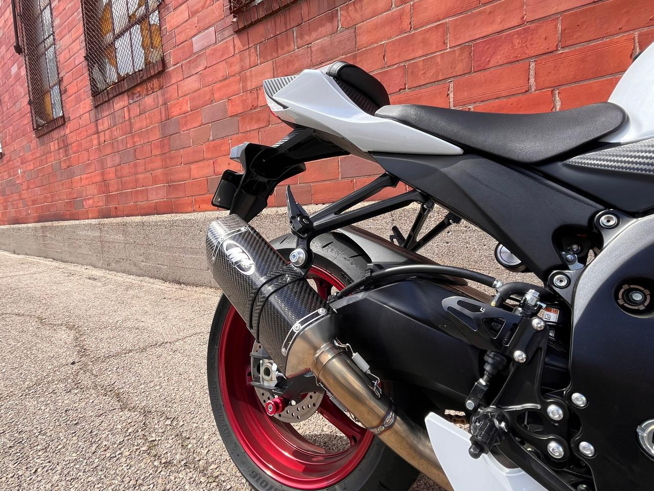 M4 Performance Exhausts M4 Tech1 Full Carbon Fiber Exhaust Titanium Midpipe Suzuki GSXR600/750 (11-26), close-up view of a motorcycle's exhaust system with carbon fiber finish and titanium midpipe.