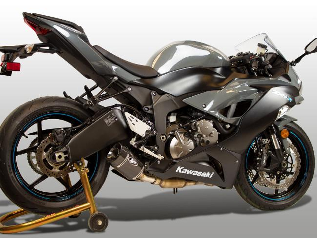 M4 Performance Exhausts M4 Carbon Fiber Street Slayer Slip On Kawasaki ZX-6R (09-25), high-performance motorcycle with a sleek design and carbon fiber slip-on exhaust.