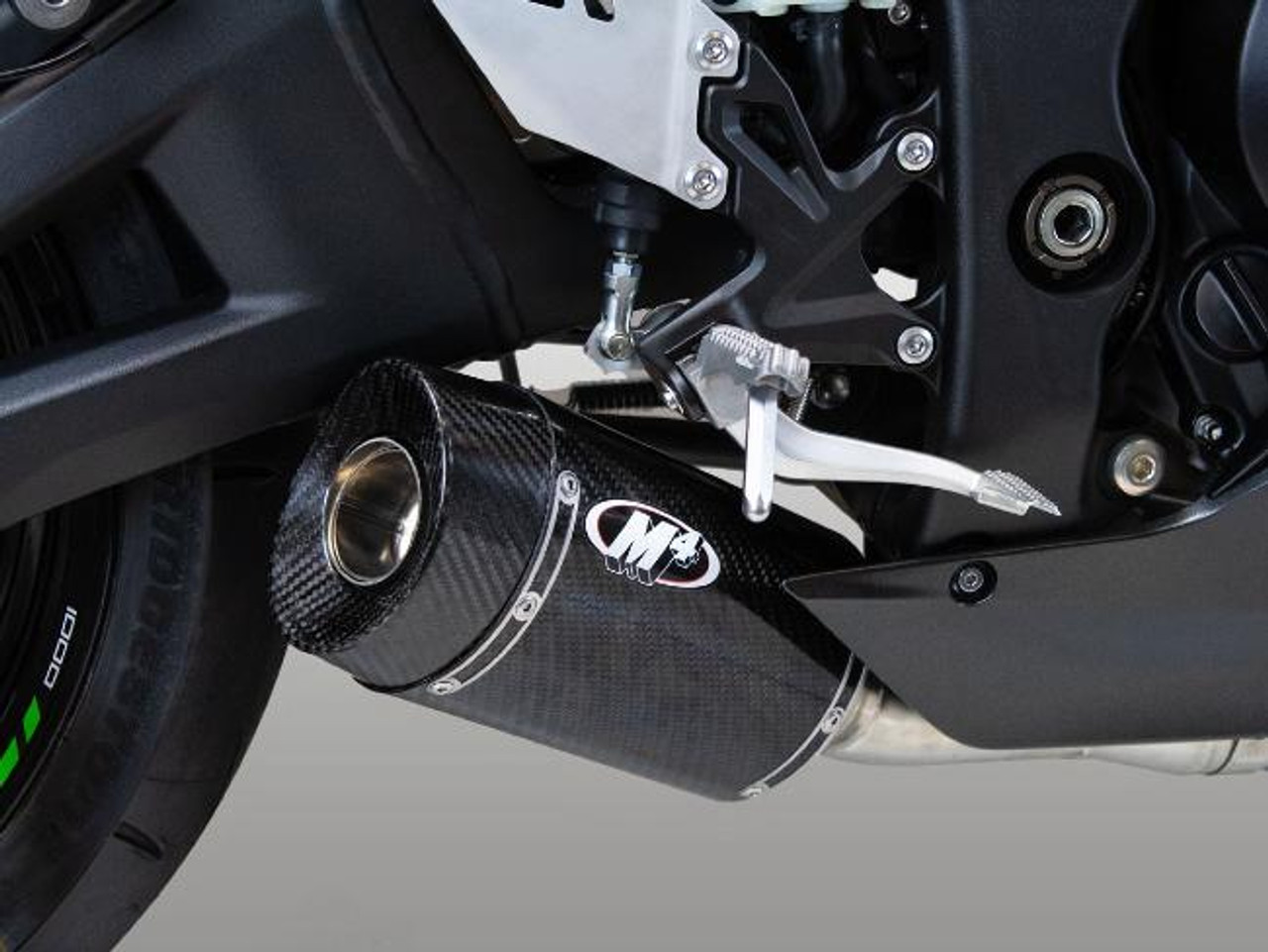 M4 Performance Exhausts M4 Street Slayer Carbon Slip On Exhaust for Kawasaki ZX-10R (21-25), close-up of the high-performance carbon fiber exhaust on the motorcycle.