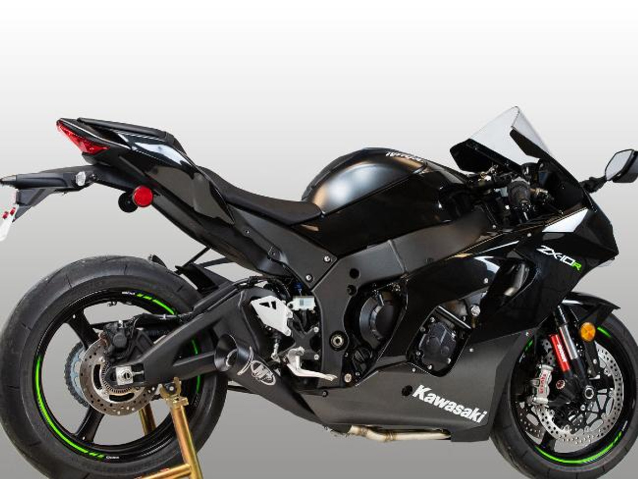M4 Performance Exhausts M4 GP Black Exhaust Kawasaki ZX-10R (21-25) All Titanium, motorcycle with black body and green accents, featuring a sleek all titanium exhaust system.