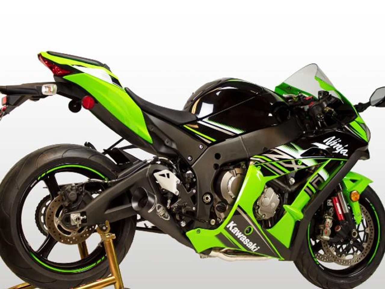 M4 Performance Exhausts M4 GP Black Exhaust Kawasaki ZX-10R (16-20) All Titanium, motorcycle with vibrant green, black, and white fairing, showcasing the high-performance exhaust system.