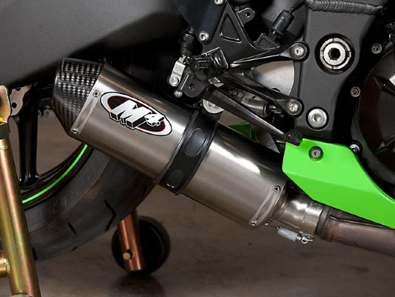 M4 Performance Exhausts M4 Street Slayer Titanium Slip On Exhaust Kawasaki ZX-10 (08-10), close-up view of the titanium exhaust mounted on the motorcycle with visible M4 logo and carbon fiber end cap.