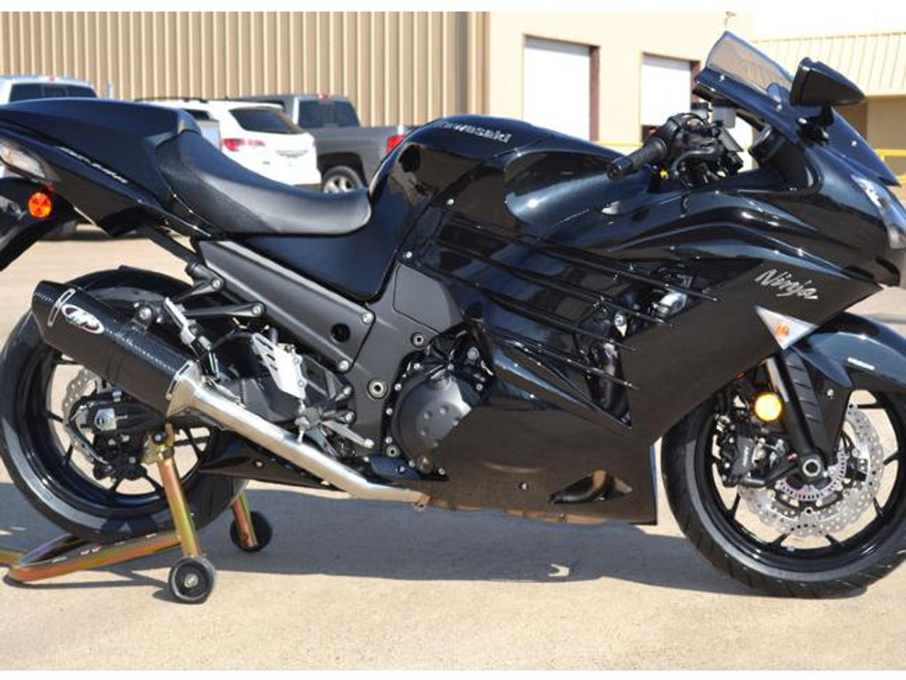 M4 Performance Exhausts M4 MC36 Carbon Fiber Slip On Kawasaki ZX-14 (12-25), black motorcycle with aftermarket exhaust system.