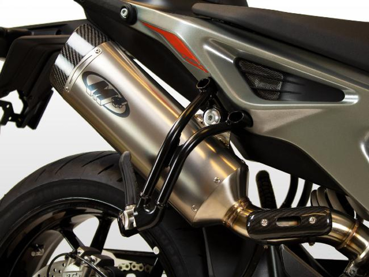 M4 Performance Exhausts M4 Titanium Slip On KTM Duke 790/890 Adventure (18-23), close-up of titanium exhaust system with black pipes and logo, mounted on a motorcycle.