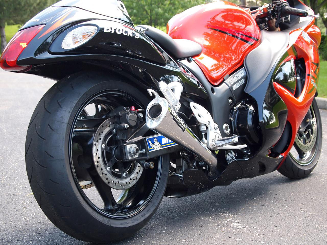 Brocks Performance Brocks Dual Alien Head Slip On Exhaust for Suzuki Hayabusa (08-21), close-up of motorcycle rear with black and red body, showcasing the exhaust pipe and rear tire.