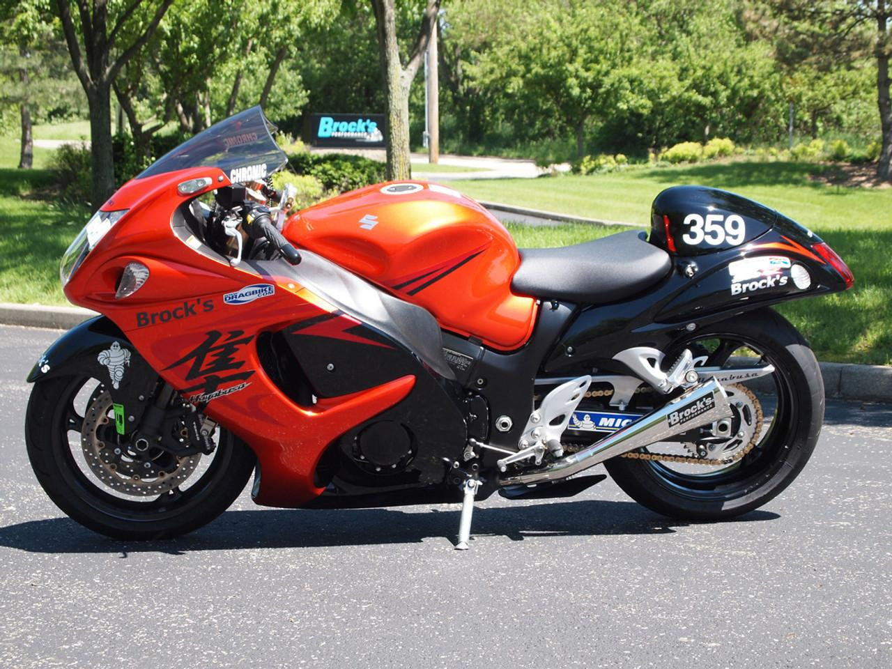Brocks Performance Brocks Dual Alien Head Slip On Exhaust Suzuki Hayabusa (08-21), motorcycle with red and black fairings, featuring Brocks branding and custom decals.
