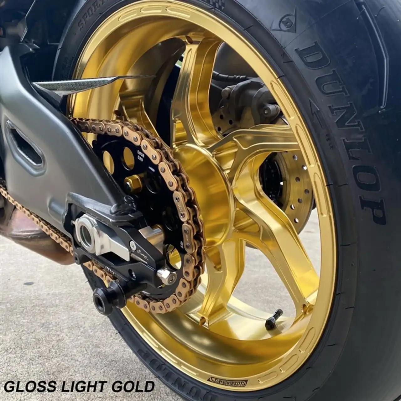 Coremoto Apex-6 Forged Aluminum Wheels Honda CBR1000RR (08-16) Non ABS, gold-colored motorcycle wheel with a black and gold chain, and brake disc.