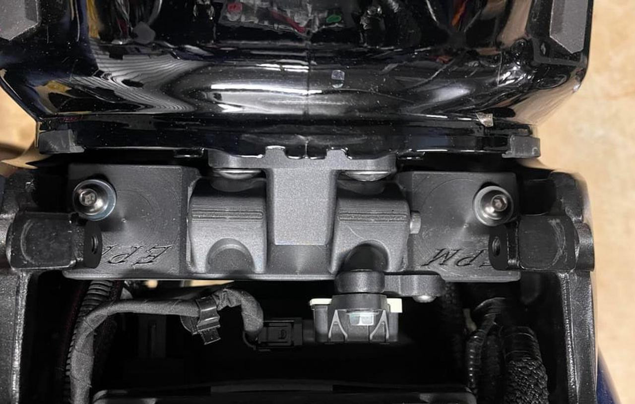 Elite Performance Machine Lightweight Gas Tank Mount Suzuki Hayabusa (22-25), black metal mount secured to the motorcycle's frame.