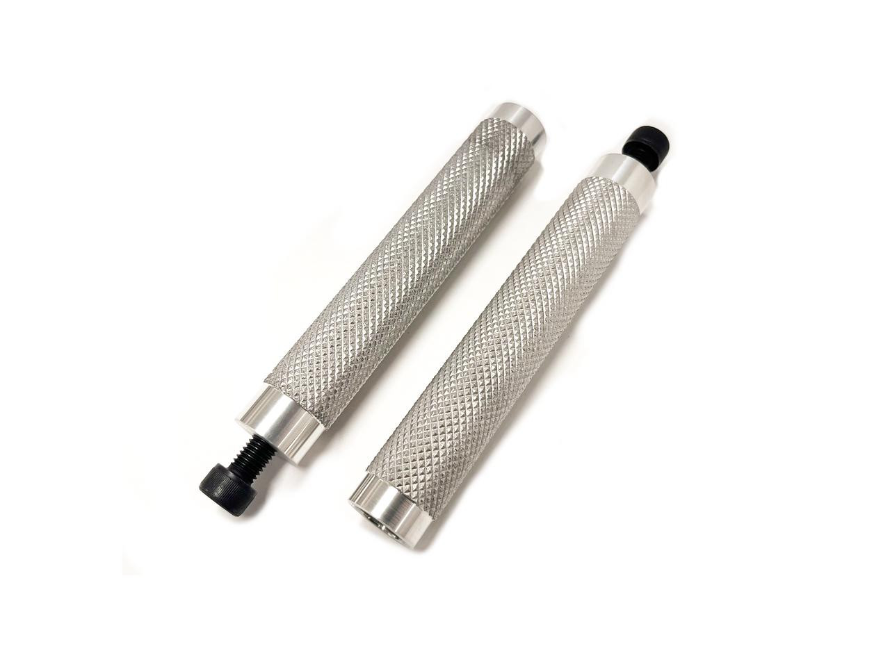 Schnitz Racing Footpegs, pair of metallic, knurled motorcycle footpegs with threaded ends for secure installation. Schnitz Racing Footpegs, pair of metallic, knurled motorcycle footpegs with threaded ends for secure installation.
