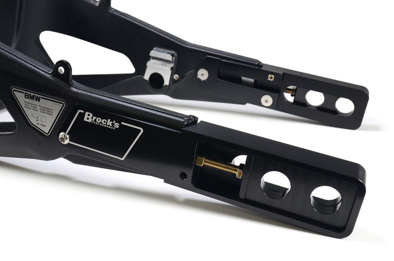 Brocks Performance Brocks Bolt-On Swingarm Extensions for BMW S1000RR (20-25), black motorcycle accessory parts for enhancing rear wheel stability and customization.