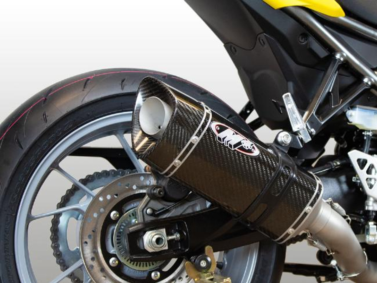 M4 Performance Exhausts M4 Carbon Fiber Full System Suzuki GSX-8R (24-25), close-up view of the high-performance motorcycle exhaust with carbon fiber construction mounted on the rear of the bike. M4 Performance Exhausts M4 Carbon Fiber Full System Suzuki GSX-8R (24-25), close-up view of the high-performance motorcycle exhaust with carbon fiber construction mounted on the rear of the bike.