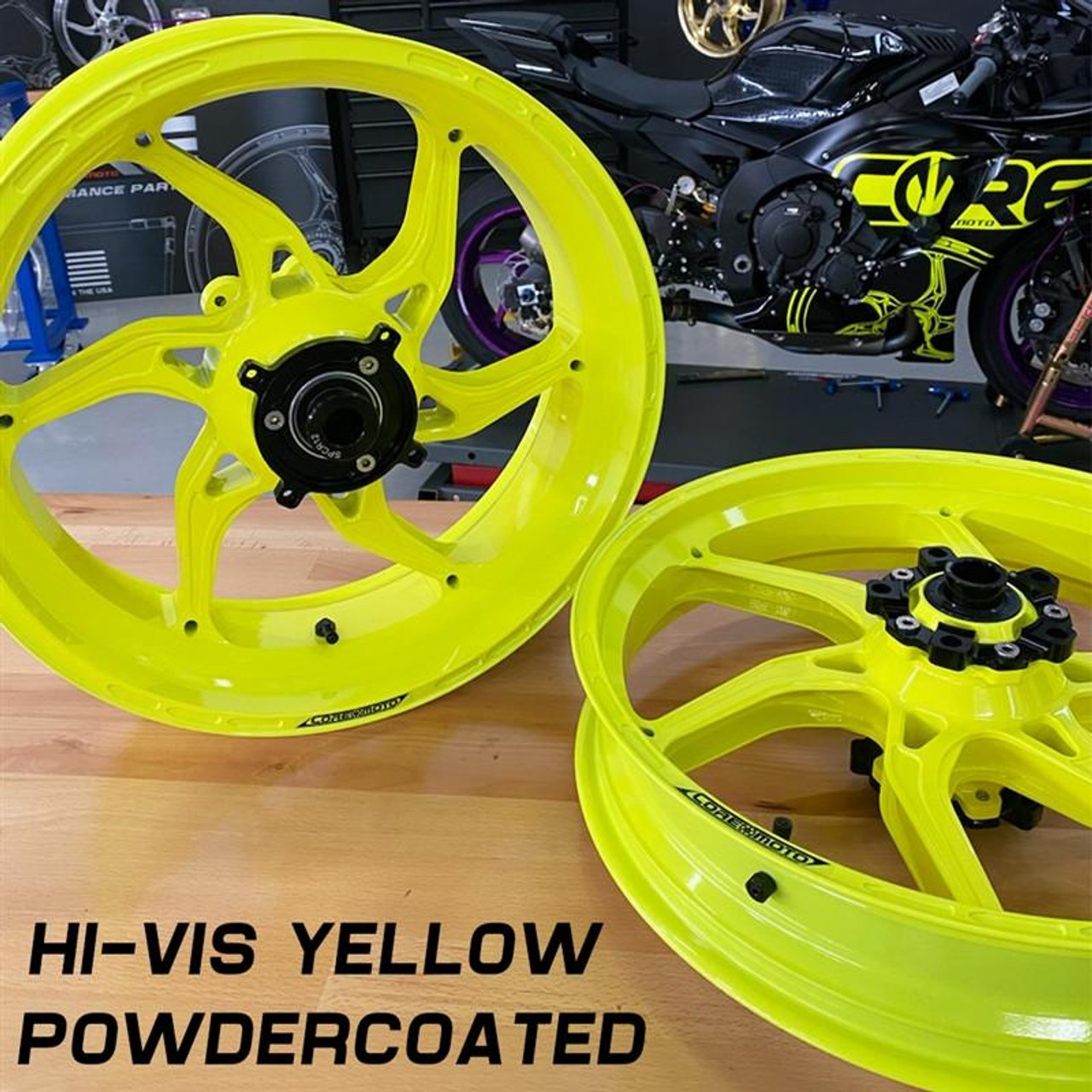 Coremoto Apex-6 Forged Aluminum Wheels Yamaha YZF-R6 17-24, high-visibility yellow, powder-coated motorcycle wheels displayed on a wooden surface with a Yamaha YZF-R6 sportbike in the background.