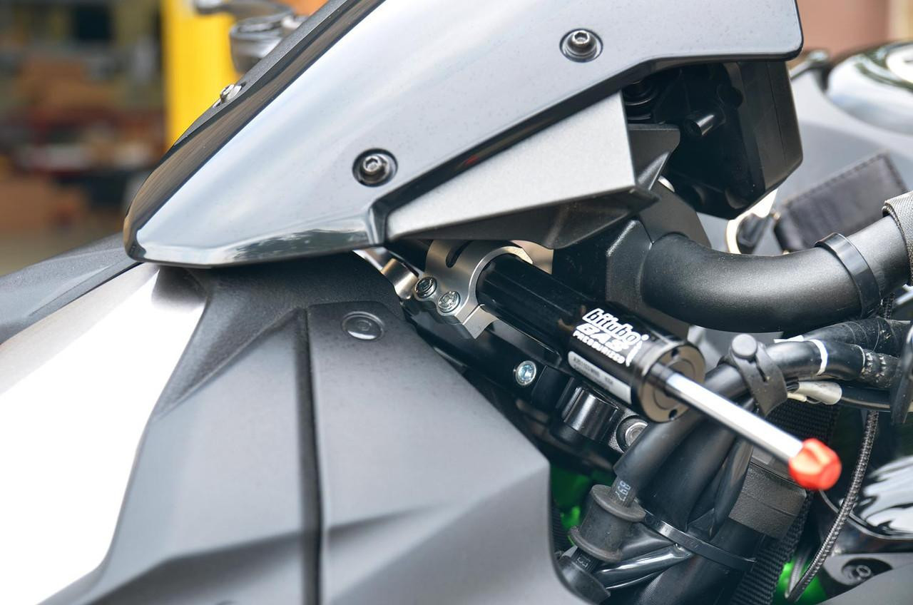 Brocks Performance Brocks Bitubo Steering Damper Kit Kawasaki Z H2 (20-25), close-up view of the black steering damper installed on the motorcycle's handlebar area.