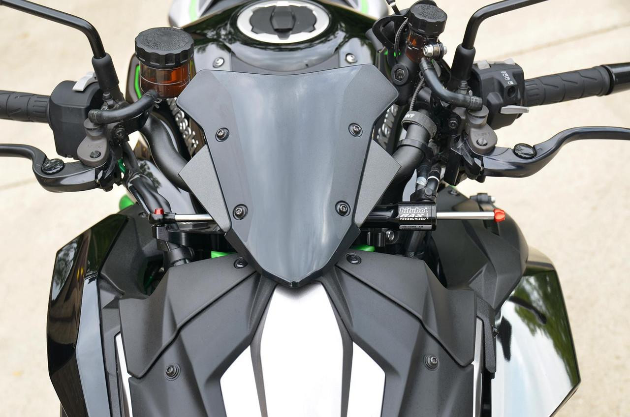 Brocks Performance Brocks Bitubo Steering Damper Kit Kawasaki Z H2 (20-25), close-up of the motorcycle's handlebar and front body, showcasing the steering damper installed on the right side.