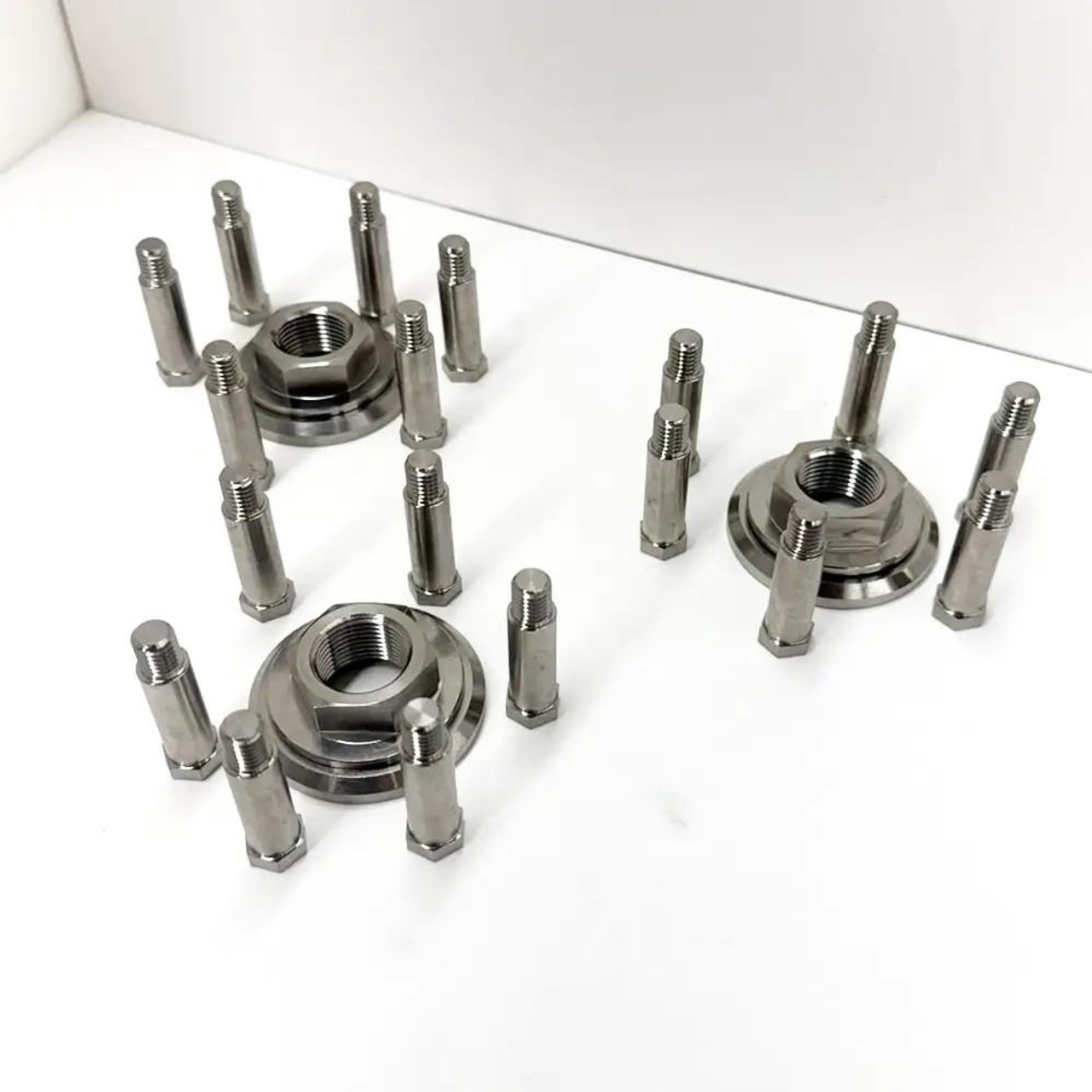 Ironless Innovations Titanium Clutch Mod And Hardware Kit Kawasaki ZX14R, polished titanium clutch components with bolts and hardware displayed on a white surface.