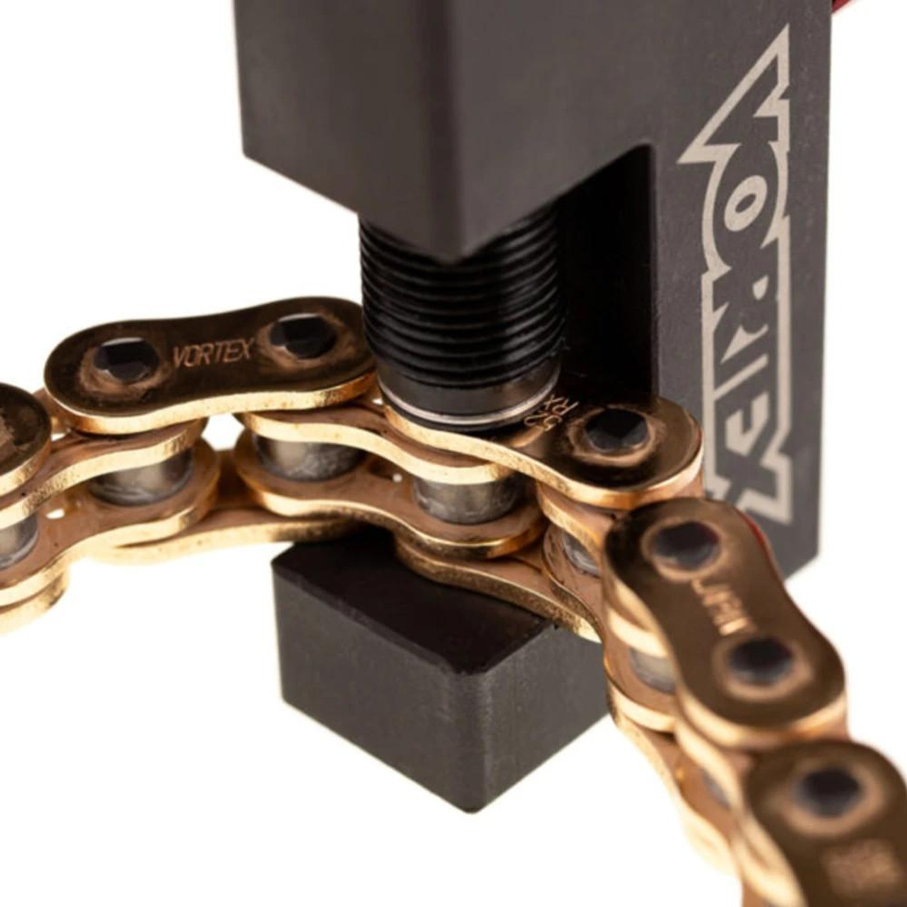 Vortex Racing Chain Tool, close-up of the chain breaking and riveting tool used for motorcycle chain maintenance, showing the chain being pressed and shaped.