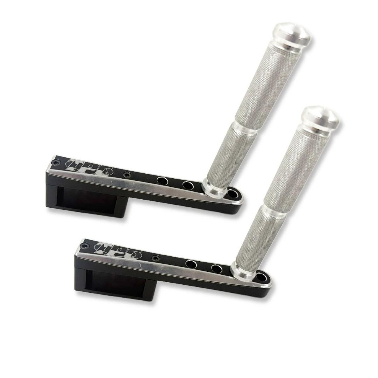 Total Performance Cycle TPC Swingarm Footpegs, motorcycle swingarm footpegs with textured aluminum footrests and black mounting brackets for enhanced grip and style. Total Performance Cycle TPC Swingarm Footpegs, motorcycle swingarm footpegs with textured aluminum footrests and black mounting brackets for enhanced grip and style.