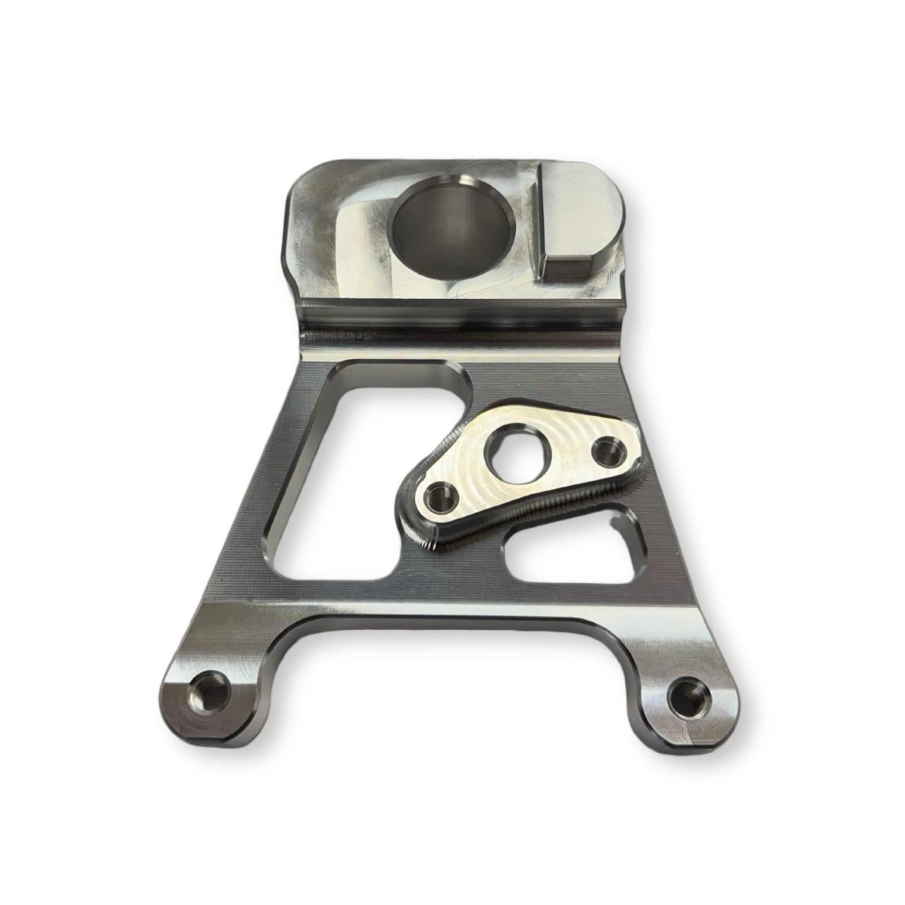 Brutal Performance Lightweight Rear Caliper Hanger Kawasaki ZX-14R (06-25), close-up view of the motorcycle rear caliper hanger in metallic finish with mounting holes and detailed design.