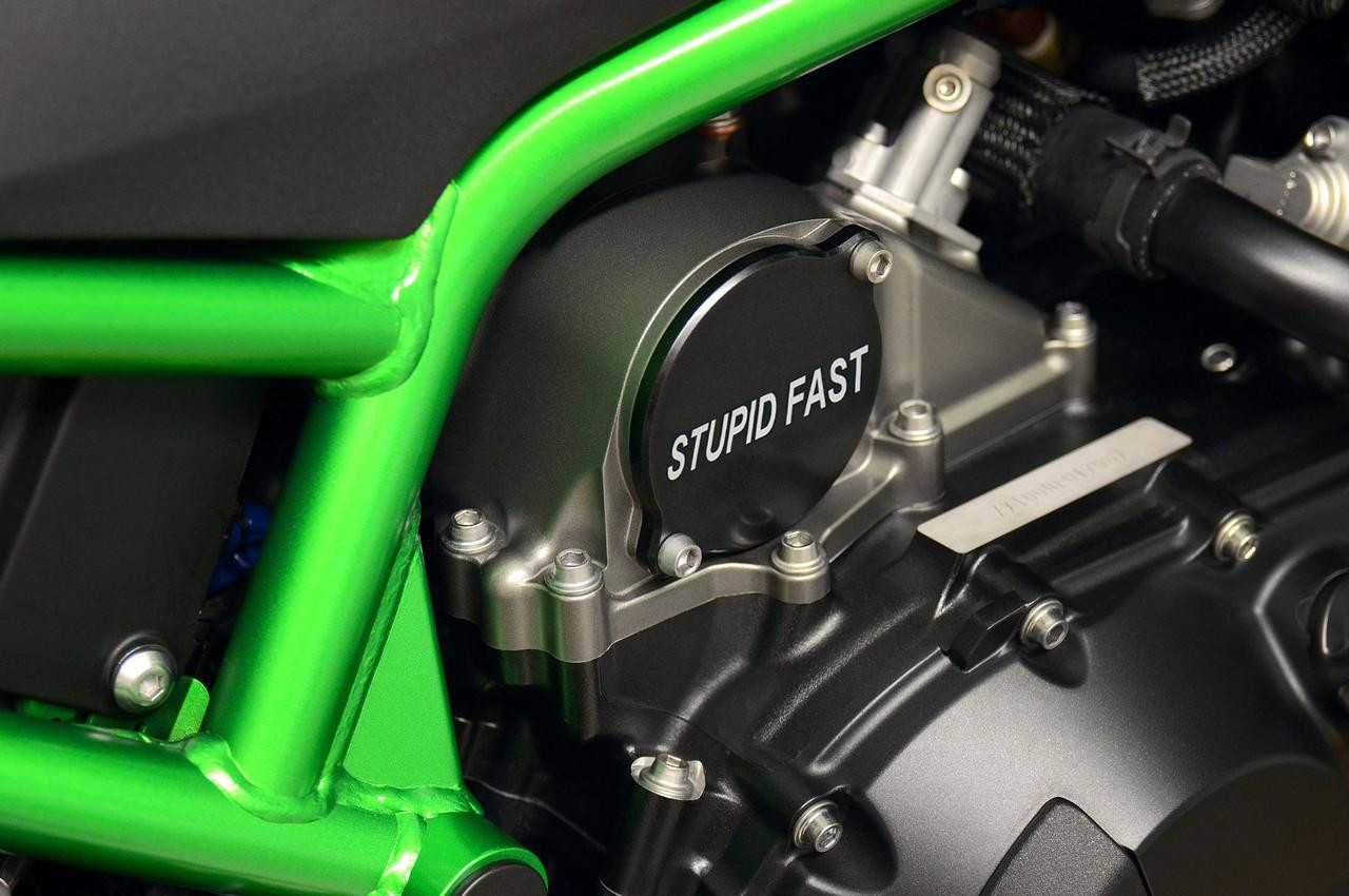 Brocks Performance Supercharger Sprocket Cover 'Stupid Fast' for Z H2, Ninja H2, and Ninja H2 SX, SE, SE+ models, close-up view of the black cover with white 'Stupid Fast' text installed on motorcycle engine.
