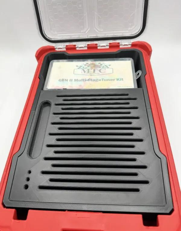 Schnitz Racing Motorcycle Performance Parts Packout Clutch Travel Case Kit, black plastic interior with storage slots and a transparent lid, red hard case exterior.