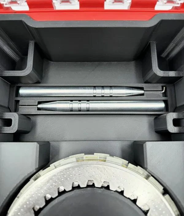 Schnitz Racing Motorcycle Performance Parts Packout Clutch Travel Case Kit, black storage case with two precision machined metal clutch hub tools inside for motorcycle maintenance.