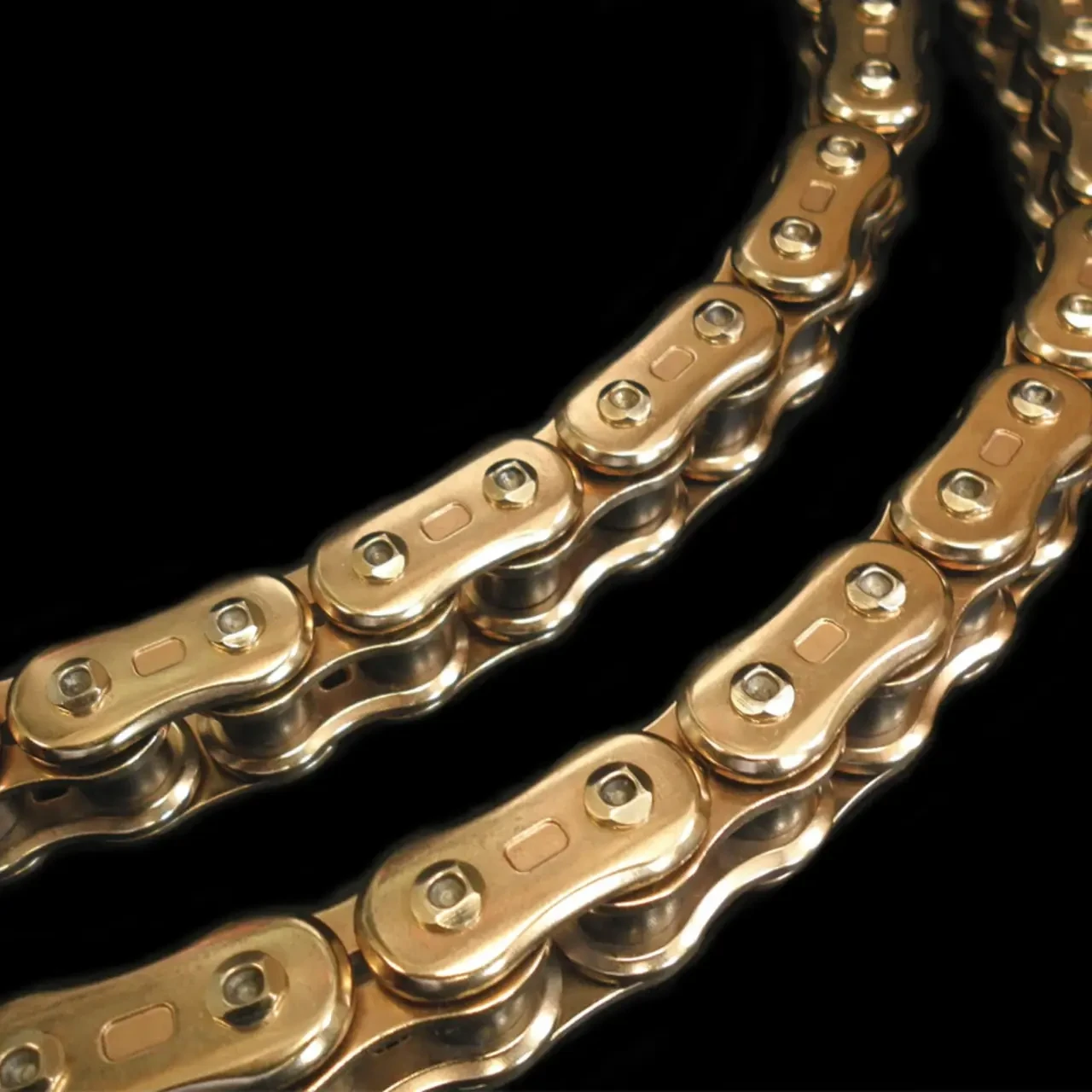 EK Chain Motorcycle Chain Parts EK Chain 525 3D QX2 X-Ring, gold-colored motorcycle chain link with precision machining and durability for optimal motorcycle performance.