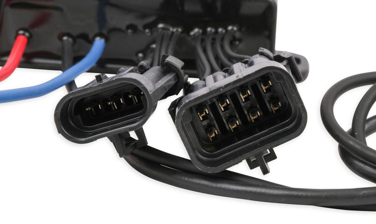 NOS 2 Stage Mini Nitrous Controller, close-up of black electrical connectors with multiple pins for vehicle wiring. NOS 2 Stage Mini Nitrous Controller, close-up of black electrical connectors with multiple pins for vehicle wiring.